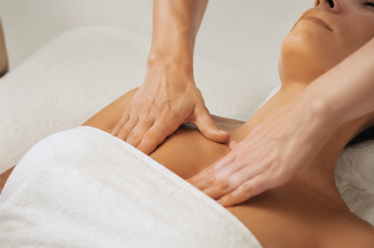 Calming therapeutic massage room for lymphatic drainage and chronic pain support